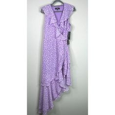 New Lulus Cornelia Floral Midi Wrap Dress Purple Women's Size Xl Brand: Lulus Color: Purple, White Size: Women's Size Xl Pit To Pit: 19" Length: 57" Materials: Polyester Condition: Nwt New With Tags Smoke-Free Home. Ships Quickly!! Lulus Exclusive! Stop And Smell The Flowers In The Lulus Cornelia Lavender Floral Print Ruffled Wrap Midi Dress! A Ruffled, Surplice Neckline And Darted, Sleeveless Bodice Are Made From Breezy Woven Fabric In A White And Lavender Floral Print. Tying Waist With Interna Stop And Smell The Flowers, Lavender Floral, Midi Wrap Dress, Wrap Midi Dress, Dress Purple, Tie Top, Purple Dress, Color Purple, Woven Fabric