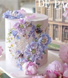 a close up of a cake with flowers on it