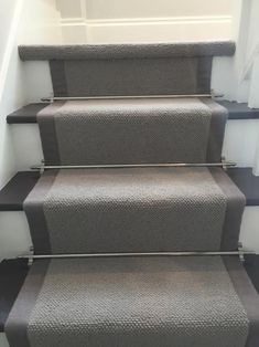 a set of stairs with carpeted treads