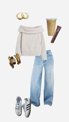 a woman in white sweater and jeans with gold accessories on her feet, coffee cup, sunglasses