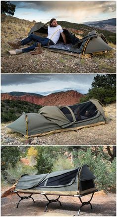 a man laying on top of a tent in the middle of some dirt and grass