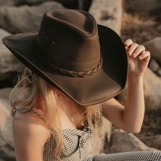 Description This womens leather cowboy hat is the perfect pairing of form and function. Built using durable, finished, 100% leather, it's built to last and protect you from the sun and rain on any adventure. Yet with its curved brim, all-leather braided band, and beautiful finish, it's one of our best-looking hats. Choose from a bright, stylish copper leather, or all-black desperado look. This hat is perfect for you! - Brim 3" Crown 4" - Sewn in Sweatband - Leather - Featherweight - Durable, fin Cowboy Hats Women, Posters Wallpaper, Brown Cowboy Hat, Hats For Big Heads, Leather Cowboy Hats, American Hat Makers, Black Cowboy Hat, Outback Hat, Hat Aesthetic