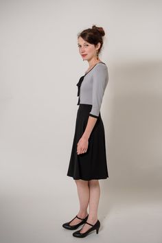 Simple and elegant, two-colored jesey dress with a small bow at the neckline. With this dress in light grey and blacl you can not go wrong. Length ca. 100 Material jersey: 92% viscose, 8% elastane Black A-line Dress For Office Wear, Black Fitted Midi Dress With Bow, Black Knee-length Dress With Bow, Social Media Buttons, Sunday Dress, Small Bows, Dress Black, Light Grey, Women Wear