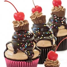 cupcakes with chocolate frosting and sprinkles on top, topped with cherries