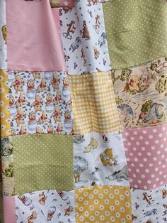 the winnie the pooh quilt has many different colors