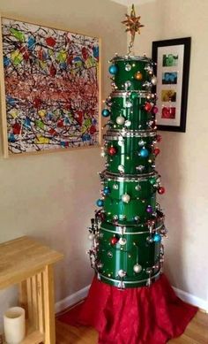 a christmas tree made out of tin cans