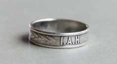 "Gorgeous early 1900's Silver I.A.H. Christian religious ring The initials I.A.H. are embossed on the front of the ring with sprigs of leaves on either side. The initials stand for \"I am His\", in reference to Jesus. This ring went along with a Christian program that started in the late 1800's. This would make a very lovely promise ring! No markings. Tests around 800 silver US Size 4 3/4 Band measures approximately 5mm wide." Vintage 14k Engraved Ring For Commemoration, Vintage 14k Stamped Engraved Ring For Commemoration, Vintage Engraved Ring Stamped 14k For Commemoration, Heirloom Engraved Ring For Commemoration With Hallmarks, Antique Ring Stamped 14k For Commemoration, Vintage 14k Stamped Rings For Commemoration, Vintage 14k Rings For Commemoration, Vintage Engraved Signet Ring For Commemoration, Vintage Stamped Jewelry For Commemoration