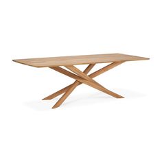 a wooden table with two crossed legs and a square shaped design on the top, against a white background