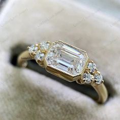 an engagement ring with three diamonds on it