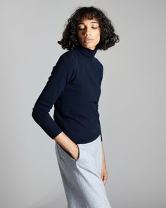 DESCRIPTIONThis turtleneck women's sweater is crafted from plain knitted kid cashmere, an extremely fine and soft fibre, obtained exclusively from the undercoat of Hircus baby goats. The mock turtleneck features a dense micro-ribbed pattern. Its precious and exclusive yarn makes this garment the luxury version of an essential knitwear item.FABRICSThe "kid cashmere" yarn is obtained from the undercoat of Hircus goats kids. The natural molt allows to harvest this precious, exclusive and ultralight Goat Kidding, Baby Goats, Cashmere Yarn, Cashmere Turtleneck, Mock Turtleneck, Women's Wardrobe, Turtleneck Sweater, Women's Sweater, Goats