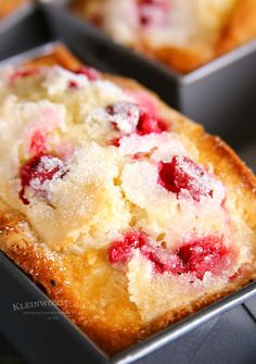 a close up of some cake in pans on a table with other pastries