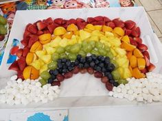 a rainbow made out of fruits and marshmallows