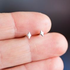 These lightweight tiny studs are an ideal addition to a look in casual style. They are minimalist and simple, attractive and modern. A great piece for everyday wear! These tiny earrings are made of fine and sterling silver. They are 2x3mm.Other tiny earrings: http://etsy.me/2jijuODThe earrings are made to order, it takes up to 5 days to ship them. You will receive them gift wrapped for no additional charge. Minimalist Silver Diamond-shaped Jewelry, Minimalist Diamond-shaped Earrings For Gift, Minimalist Sterling Silver Diamond Cut Earrings, Minimalist Diamond-shaped Everyday Jewelry, Minimalist Everyday Diamond-shaped Jewelry, Everyday Minimalist Diamond-shaped Jewelry, Minimalist Sterling Silver Diamond-shaped Earrings, Almandine Garnet, Letter Ring