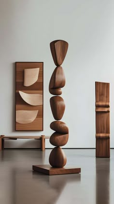 a stack of rocks sitting on top of a wooden stand in front of a painting