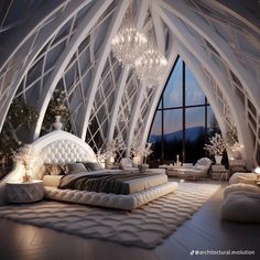 a bedroom with a large bed and chandelier hanging from it's ceiling