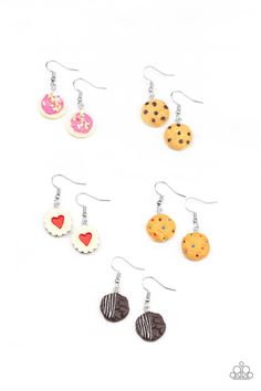 six different types of cookies and doughnuts are hanging from earwires on white background