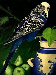 a blue and white bird sitting on top of a vase filled with apples next to green leaves