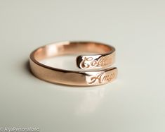 Engraved personalized name ring; wedding bands for women... Also perfect promise ring for your special woman ♡ ► FEATURES; Material Options: 14k Rose Gold, 14k Yellow Gold, 14k White Gold Size: All ring sizes are available ► HOW TO ORDER; Please select your preffered size and material from the menu while adding to card. ► PROCESSING & SHIPPING ❥We ship to worlwide, please check current delivery times depending on your location at the bottom of this page ❥Shipping time is 2-5 days to US. ❥Ple Personalized Engraved Rose Gold Ring, Customizable Rose Gold Promise Rings, Personalized Rose Gold Stackable Rings For Promise, Adjustable Engraved Rose Gold Ring For Anniversary, Adjustable Rose Gold Engraved Ring For Anniversary, Adjustable Engraved Rose Gold Promise Ring, Adjustable Engraved Wedding Rings, Adjustable Rose Gold Engraved Promise Ring, Rose Gold Engraved Promise Ring