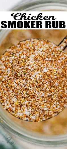 a glass jar filled with chicken and smoker rubs