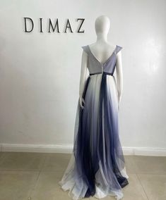 Indulge in timeless elegance with our blue and white long flowy tulle dress. Crafted with ethereal layers of tulle, this dress exudes grace and sophistication. The delicate blue and white hues blend seamlessly, creating a mesmerizing ombré effect. Its flowing silhouette dances with every step, while the fitted bodice accentuates your curves. Perfect for formal events or a romantic evening, this dress will make you feel like a true goddess. DETAILS Polyester fabric Zip closure Flowy skirt Fitted Flowy Tulle Dress, African Suit, Belted Pants, Romantic Evening, Ombre Effect, Skirt Fits, Fitted Top, Flowy Skirt, British Indian