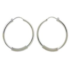 Exploring silver textures Wadarat Supasirisuk wraps a sterling twist around gleaming hoops. The result is a pair of striking earrings with timeless appeal handcrafted in sterling silver (0.925). Paw Print Jewelry, Ribbon Jewelry, Printed Jewelry, Earrings Hoop, Flip Flop Shoes, Sterling Silver Hoop Earrings, Sterling Silver Hoops, Jewelry Packaging, Silver Hoops