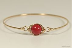 Wire Wrapped Red Coral Swarovski Pearl Bracelet Handmade by Jessica Luu Jewelry ~ Sophisticated ~ Versatile ~ Elegant ~ Perfect for everyday wear, this bangle adds a touch of casual elegance to every occasion - available in 2 metal choices. MATCHING ITEMS https://www.etsy.com/shop/JessicaLuuJewelry?search_query=red+coral+pearl MATERIALS: ~ 10mm red coral Swarovski pearl ~ 14K yellow or rose gold filled wire HOW IT'S MADE: A large Swarovski pearl is wire wrapped in a herringbone style then attach Red Hand Wrapped Bracelets, Adjustable Red Bracelets For Formal Occasions, Adjustable Red Wire Wrapped Bracelets, Elegant Handmade Red Bangle, Elegant Red Adjustable Bangle, Red Adjustable Wire Wrapped Bracelets, Elegant Red Handmade Bangle, Adjustable Red Bead Bangle, Adjustable Red Wire Wrapped Bracelet