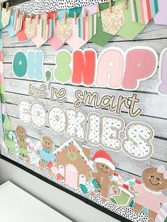 there is a sign that says oh snap we're smart cookies on the wall