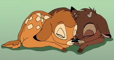 two cartoon animals laying next to each other on a green floor with their heads together