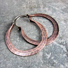 "Large, earthy and beautiful Copper Rio hoop earrings are hand forged from large 10 gauge copper wire. Ear wires are made from *18 gauge sterling silver. They have a satin brushed finish highlighting their beautiful hammered texture and color. Perfect for a weekend in Rio or anywhere a pair big boho hoops are needed to add that edgy punch to your wardrobe! The pair in the photos have an oxidized finish. NOTE: Made To Order...Please allow 7 - 10 business days for completion. Earrings measure 2.25 Hammered Copper Round Hoop Earrings, Hammered Copper Hoop Jewelry, Artisan Copper Hoop Earrings Nickel Free, Small Copper Hoop Jewelry, Hammered, Artisan Electroformed Hoop Earrings, Artisan Nickel Free Copper Hoop Earrings, Hammered Copper Hoop Earrings As Gift, Copper Hammered Hoop Earrings As Gift, Small Hoop Hammered Copper Earrings