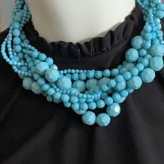 Multi Strand Faceted Beads In Different Sizes Statement Necklace In Turquoise Blue. Brass Adjustable Closure. Elegant Large Beads Turquoise Necklace, Elegant Turquoise Necklace With Large Blue Beads, Elegant Blue Turquoise Necklace With Faceted Beads, Elegant Blue Turquoise Necklace With Large Beads, Turquoise Faceted Bead Necklaces, Turquoise Bib Necklace With Round Beads For Gifts, Turquoise Faceted Beaded Costume Jewelry Necklace, Turquoise Faceted Beads Costume Jewelry Necklace, Turquoise Faceted Beads Costume Necklace