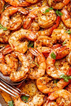 cooked shrimp and asparagus in a skillet