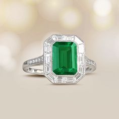 This ring features an emerald-cut Zambian emerald weighing 2.25 carats. The center stone is bezel-set and surrounded by a halo of baguette-cut diamonds weighing 0.75 carats. The shoulders are set with an additional five diamonds on each side weighing approximately 0.10 carats total. The mounting is decorated with an openwork under gallery and fine milgrain.
The measurements of this ring including the diamond halo are 13.35mm x 11.25mm. The measurements of the center stone are approximately 9.47m Luxury Emerald-cut Emerald Ring With Halo Design, Luxury Emerald Cut Emerald Ring With Halo Design, Green Emerald Cut Halo Ring In Platinum, Green Emerald-cut Platinum Halo Ring, Luxury Emerald Baguette Cut Bezel Set Ring, Platinum Emerald Cut Emerald Ring With Halo Design, Gia Certified Emerald Cut Halo Ring, Emerald-cut Platinum Halo Ring, Emerald Cut Platinum Halo Ring