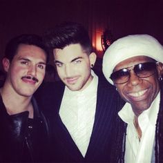 three men are posing for a photo together