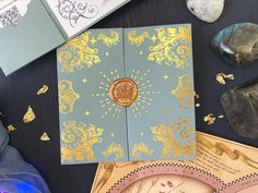 there are many different types of cards on the table, including one with a gold design