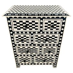 a black and white checkered dresser with drawers