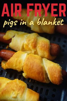 there are pigs in a blanket and hot dogs on the grill with text overlay that says air fryer pigs in a blanket