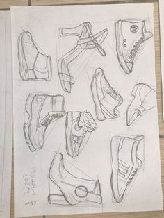 several sketches of shoes are shown on paper