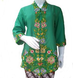 Green Kebaya embroidery, very fresh color,when you wear this it's look like walk in the forest, you can imagine green leaf with floral, green and colorful floral, very beautiful and nature. Material : cotton  that is so comfort, light weight  Material:   *100 % cotton * button *embroidery ribbon Size: Xl;  bust: 102 cm, your bust around should 98 cm or below long: 78 cm sleeve: 40 cm 2L: bust: 106 cm, your bust should 102 cm or below long: 79cm sleeve:40 cm This listing only kebaya,  Do you want another kebaya please click: https://www.etsy.com/shop/TantyzaaIndonesia?ref=seller-platform-mcnav&section_id=27530139 Need Sarong Skirt For Kebaya? Please visit this link: https://www.etsy.com/shop/TantyzaaIndonesia?ref=seller-platform-mcnav&section_id=32392933 Jewelry for kebaya please visit: htt Festive Green Floral Print Blouse, Festive Green Floral Print Tops, Festive Spring Green Blouse, Festive Green Spring Blouse, Traditional Green Floral Print Top, Traditional Green Blouse For Spring, Traditional Green Tops With Floral Embroidery, Traditional Green Long Sleeve Tops, Green Floral Embroidered Blouse For Festivals