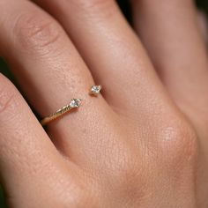 Twin sparkling white sapphires cap each end of this textured open band ring. Lovely on its own and stacks beautifully with our other rings, especially our Daybreak Ring. Inspired by the roots of the Banyan tree, our signature texture is a symbol of strength, growth, and self-awareness. Solid gold, always — in your choice of 9k or 14k. Dainty Open Ring With Single Cut Diamonds, Dainty Single Cut Diamond Promise Rings, Dainty Crystal Open Ring With Rose Cut Diamonds, Single Cut Diamond Stackable Open Rings As Promise Ring, Single Cut Diamonds Open Stackable Promise Rings, Dainty Rings With Single Cut Diamonds, Dainty Diamond Ring With Si Clarity, Recycled Gold Open Ring For Promise, Minimalist Stackable Open Rings With Rose Cut Diamonds