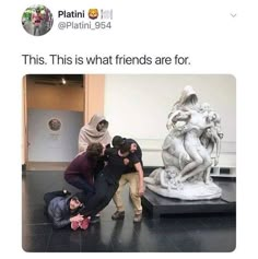 four people standing in front of a statue with the caption'this is what friends are for '