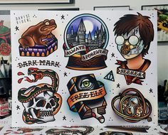 an assortment of tattoos and stickers on a table