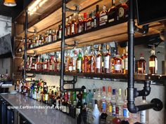 the bar is stocked with many different types of liquor