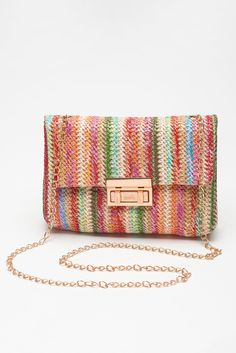 Elevate your style with the TRAVELING GYPSY- Bohemian Woven Gold Chain Shoulder Bag. The intricately woven design adds a touch of bohemian flair, while the shimmering gold chain strap makes a statement. The stylish flap closure keeps your essentials secure, making this bag the perfect blend of bohemian and elegance. Material: 100%Straw Chic Multicolor Crochet Bag With Braided Handles, Chic Multicolor Woven Bag, Multicolor Spring Bags, Chic Multicolor Crochet Shoulder Bag, Trendy Multicolor Crochet Bag, Spring Multicolor Woven Shoulder Bag, Trendy Multicolor Crochet Bag With Adjustable Strap, Trendy Woven Bags As Fashion Accessory, Chic Multicolor Rectangular Crochet Bag