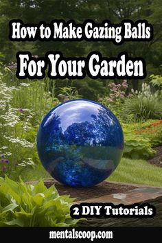 a blue glass ball sitting on top of a rock in the middle of a garden