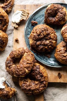 chocolate chip cookies on a plate with whipped cream in the middle and other baked goods around them