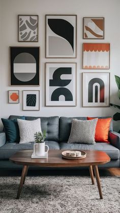 a living room filled with furniture and pictures on the wall above it's coffee table