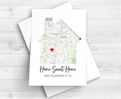 a white card with the words home sweet home on it and a red heart in the middle