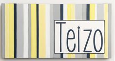 a painting with the word tezo on it in black and white, against a striped background