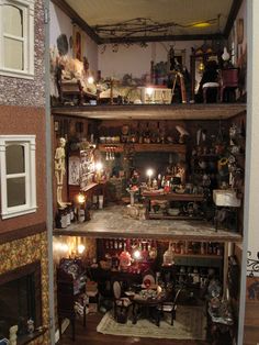 a doll house with lots of shelves and furniture