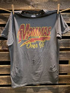 Country Deep Momma's Over it distressed unisex T shirt available in faded black 40 Singles Jersey 100% Cotton Premium quality ringspun and compacted cotton Fine Cotton Jersey that is pigment dyed for a more vintage look Features tears and destroyed features at neck and on body Each piece is unique as this process is done by hand! 3.8 oz Made In USA Every garment dye item can be a slightly different shade in color since this is a laundry dye process. Enjoy its unique quality! SIZE CHART S M L XL Country And Western, Distressed T Shirt, Rain Gear, Work Shirts, Over It, Work Pants, Western Style, Vintage Look, Shirt Sleeves